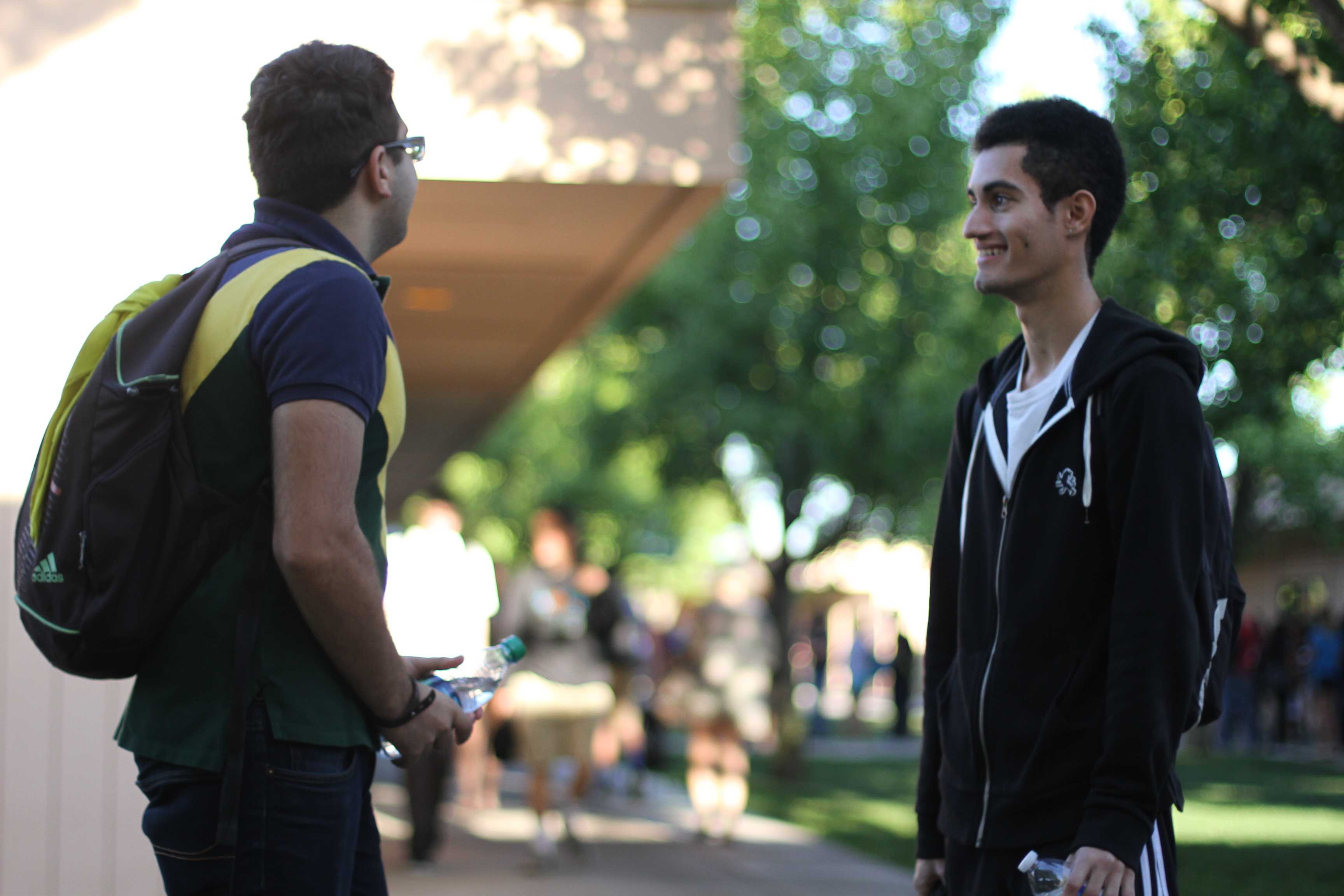 To spend time with his friend before school starts, seniors Arya Mousavi and Robbin Bagga talk minutes before first period starts. “I’d rather wait for class to start with my friend than wait inside because you can catch up with those friends you don’t always see,” Mousavi said. Photo by Lindsay Withrow