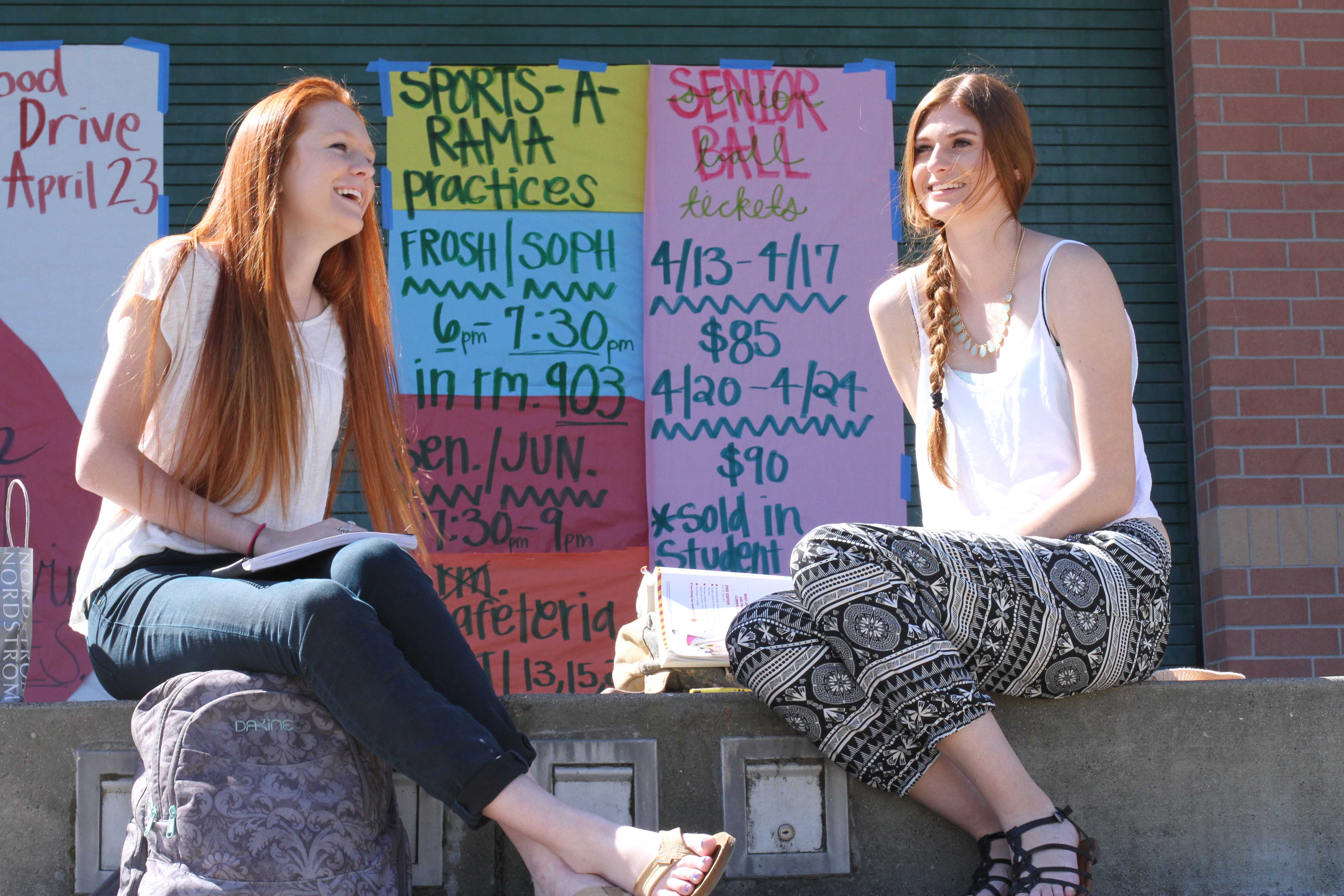 During first period, juniors Allison Cooper and Kylie Sommer sit in the sun and talk with each other. Since Sommer is a teacher’s intern and Cooper is a teacher’s assistant, they were allowed a break from their class so they went outside and took advantage of the nice weather. “Usually we go to the library because we finish our work that she has us do then we go do our homework in the library, but it’s really nice out today,” Sommer said. Photo by Reese Richmond