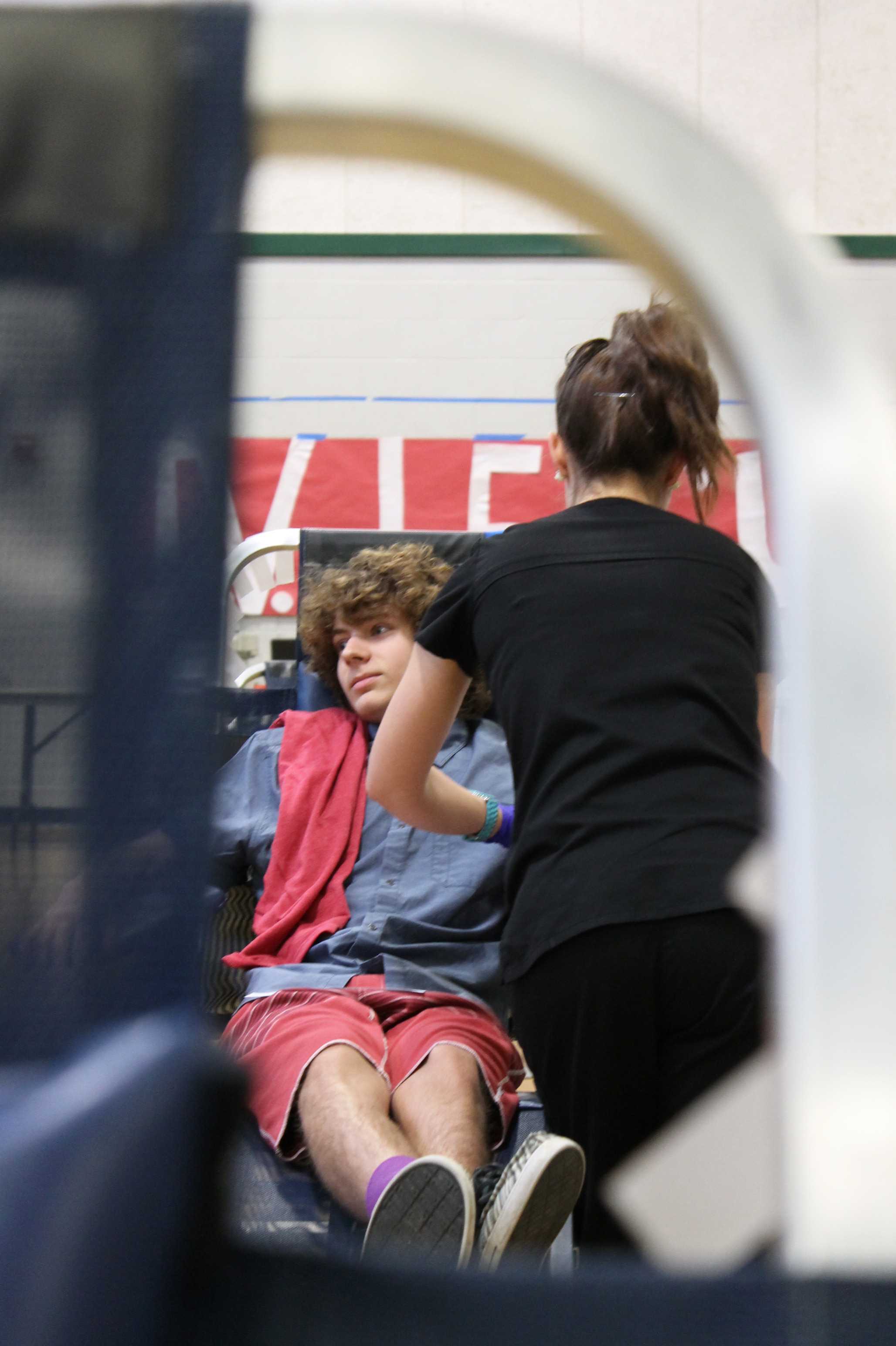 NOT COLD-BLOODED: Although it is his second time donating blood, junior Eric Childers is slightly nervous. It was a cold morning on May 23. Childer was cold and shivered while sitting on the chair, but the cold didn’t stop him from donating blood. Childers gave blood to help save a life. “I donated because other people need blood,” Childers said. Photo by Melissa Goni