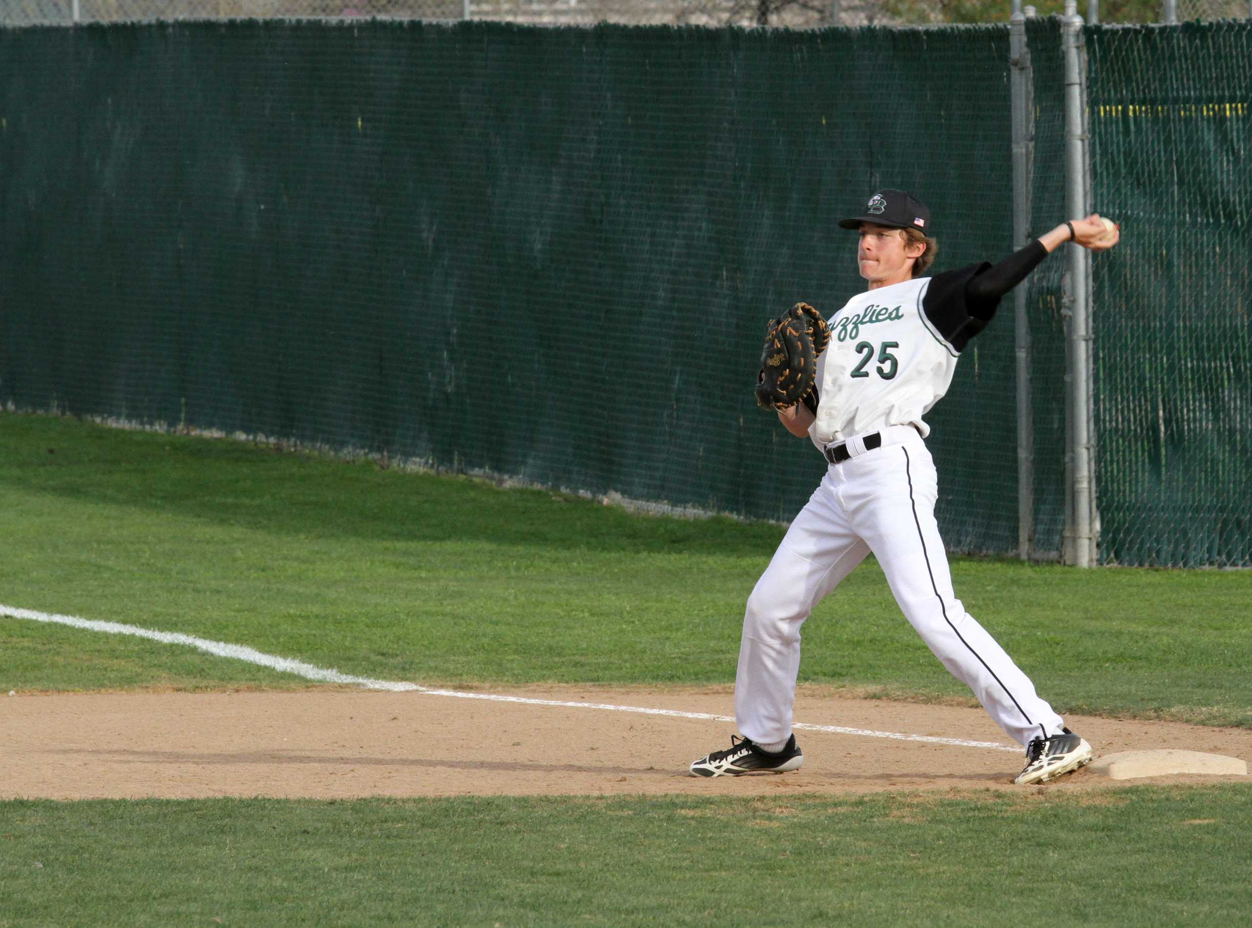 PRACTICE MAKES PERFECT: While playing a game against Rocklin on april 29th, freshman first baseman Bailey Diemer has the ball and practice some throws before they start playing. Since the GBHS baseball team got out three times, they switch positions to play defence. “We play serious and always have fun out on the field,” Diemer said. Photo by David Goni