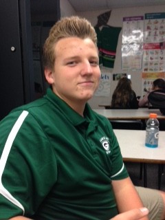 Freshman Aaron Tracy rocks his Granite Bay football polo Thursday before the game.