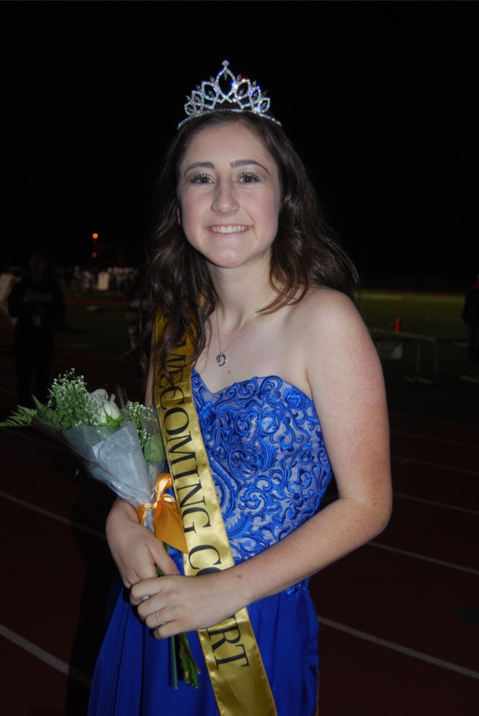 Dressed to impress, senior Danielle Griggs walks as a homecoming royalty nominee in this year’s halftime show.