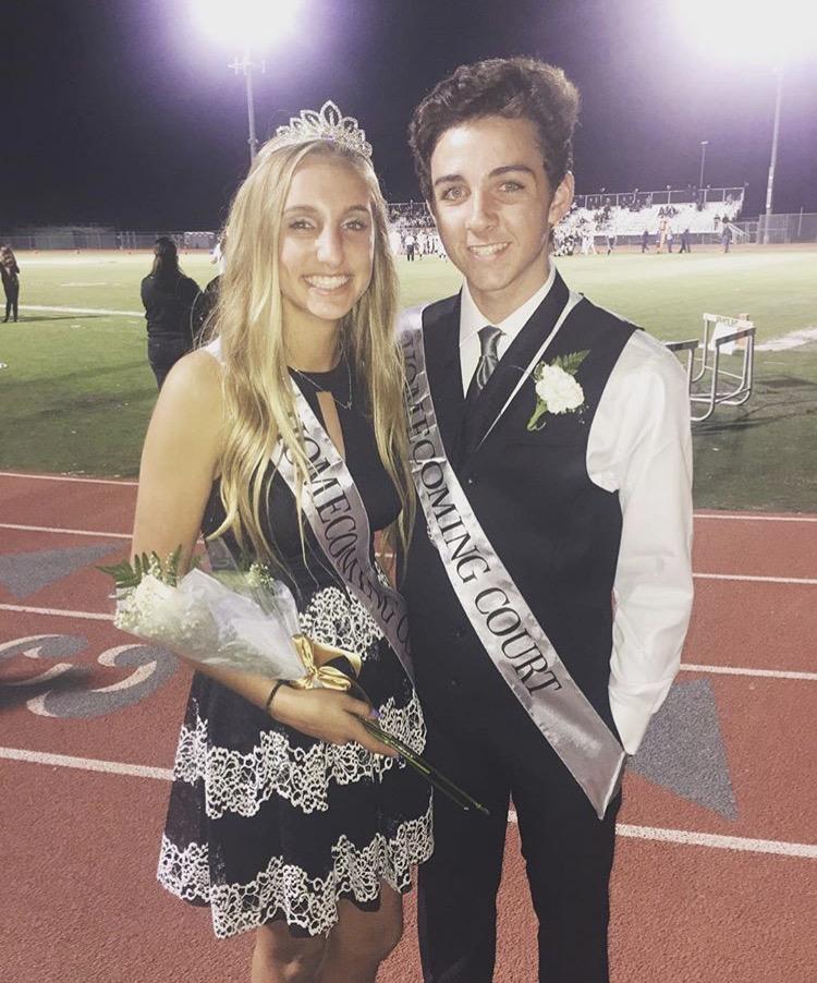 On homecoming night, freshman princess Summer Holt snaps a pic with freshman prince Cole Phillips.